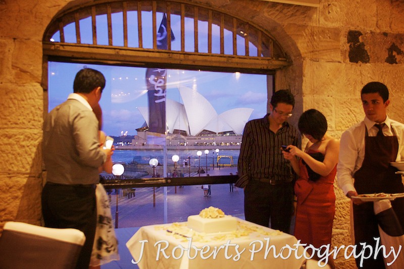 Sydney Opera House at dusk through windows of Wolfies Grill The Rocks Sydney - wedding photography sydney